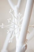 White-painted twigs and star-shaped ornament