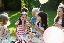 Children eating sweets at birthday party
