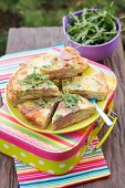 Potato tortilla with salami and green peppers