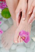 Woman taking foot bath