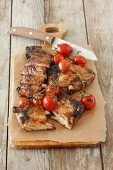 Grilled pork ribs with cocktail tomatoes