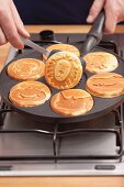 Pancakes being baked in a pancake pan