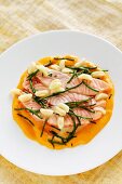 Poached salmon on warm mousseline with gnocchi