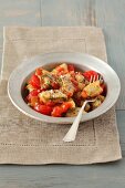 Potato and spinach dumplings with tomato sauce