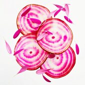 Sliced beetroot with flower petals