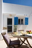 Breakfast table on terrace of white Finca