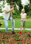 A father and daughter gardening