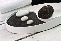 Yin and Yang dish with black pumice and white pebbles