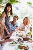 Friends eating in a garden