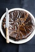 An aubergine cake seen from above