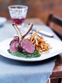 Venison chops on a bed of spinach with fried potatoes