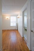 Empty room in apartment with hardwood floor