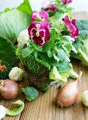 Pansies wrapped in savoy cabbage leaves