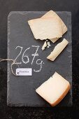 Fontina cheese with a label and its weight