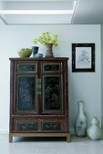 Decorative vases around armoire