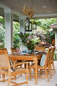 Outdoor dining area with wooden table and chairs