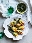 Deep-fried courgette flowers with ricotta, parmesan and mint and anchovy sauce