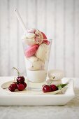 Cherry and vanilla ice cream with macaroons and vanilla and chocolate sauce