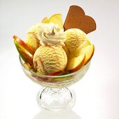 An apple ice cream sundae with cream and wafers