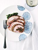 Rolled roasted turkey with pancetta, walnuts and parsley