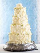Multi-tier wedding cake with ganache and white chocolate