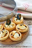 Vanilla and passion fruit tartlets and cheese and fig vol-au-vents