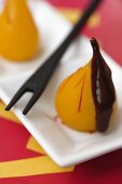 Mini poached pears with chocolate sauce for the fondue