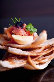 Smoke salmon tartar with lumpfish caviar on Melba toast