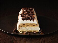 Tiramisu cake on wooden plate