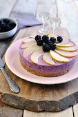 Blackberry and cream cheese cake topped with blackberries and pears