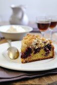 A slice of blackberry and apple crumble cake