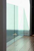 Architectural detail hardwood floor and glass railing