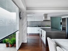 Modern Kitchen and dining room with stainless steel kitchen island