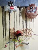 Modern coat rack with various coathangers decorated with cartoon character foil balloons