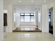 Empty modern home with white accordion doors