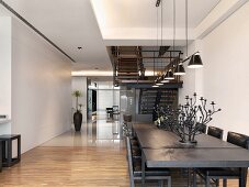 dining room table and staircase in modern home