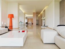 Living room with orange lamp in minimalistic home