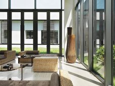 Wicker furniture in large modern sunroom