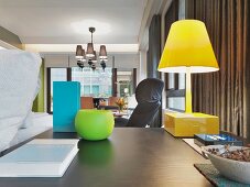Colorful lamp and vases on desk