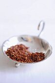 Dried rooibos in a silver dish