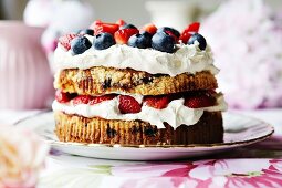 Plate of fruit and cream cake