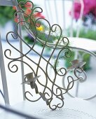 Vintage, metal wall candle sconce on a chair