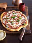 Rustic Pizza with Fresh Basil Leaves