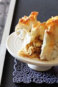 Filo pastry parcels with caramelised onions, pears and Brie