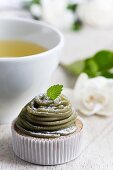 Miniature matcha-tea cake with matcha- and chestnut-flavoured icing