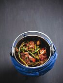 Italian pot roast with lamb and beans in a potjiekos cooking pot