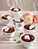 Raspberry jelly topped with cream
