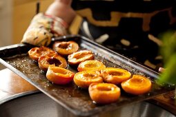 Baked peaches on a baking tray