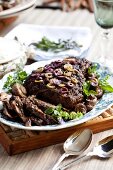 Leg of lamb with olives and mushrooms