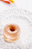 Two doughnuts with icing sugar